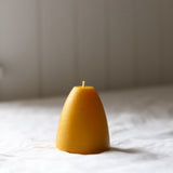 The Authentic Honey Co beeswax Dome candle. Burn-time up to 20 hours.